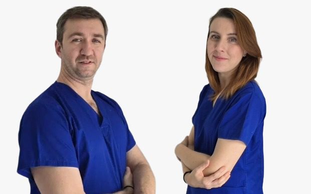 Elementor Footer: Two healthcare professionals in blue scrubs. Medical team, doctors, or nurses on white background.